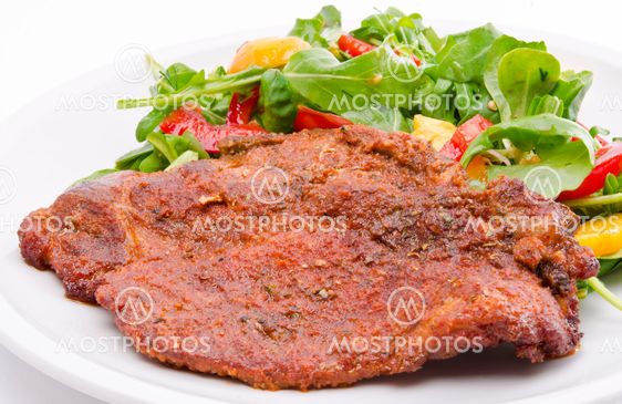 cervical chop with apricot-rocket salad