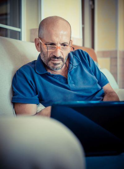 miggle age man using notebook