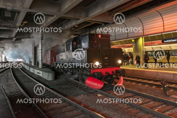 Old vintage steam train arriving at Stockholm cental...