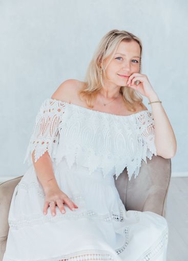 Beautiful blonde woman in summer white wedding dress