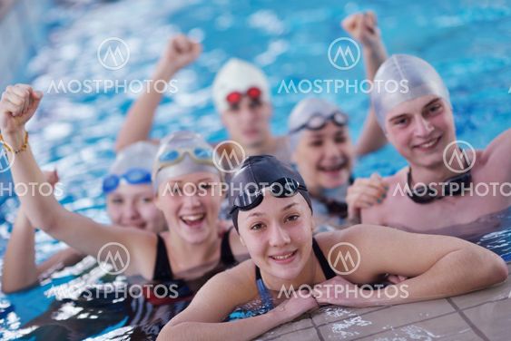 happy teen group at swimming pool