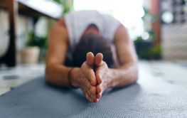 Hands, person and zen on ground yoga for back stretching,...