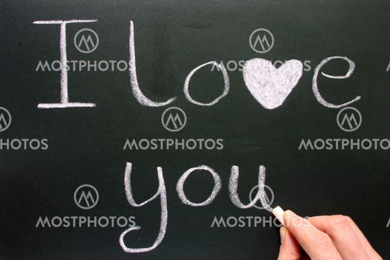 Writing I love you with pink chalk.