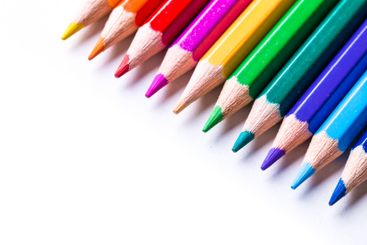 Colorful pencils arranged in a line showcasing vibrant...