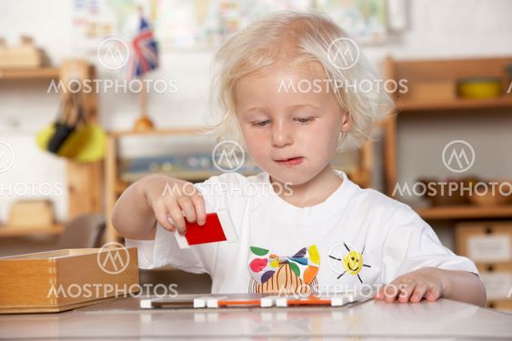 Adult Helping Young Children at Montessori/Pre-School