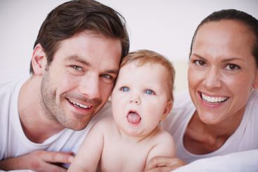 Portrait, parents and happy with baby in home for...