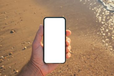 Smartphone mockup at seaside, man using mobile phone on...
