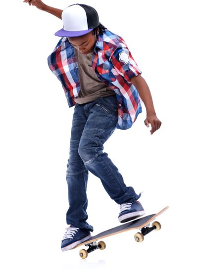Skateboard, trick or African kid in studio with trendy...