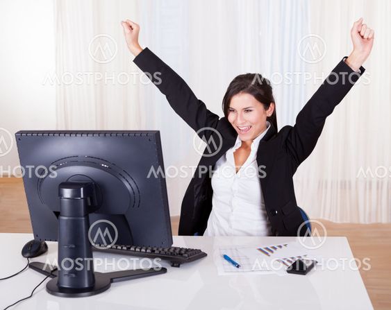 Successful businesswoman celebrating