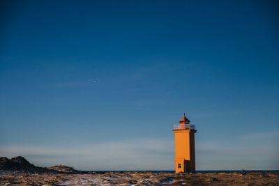 beautiful view of lighthouse and icelandic seacoast at...