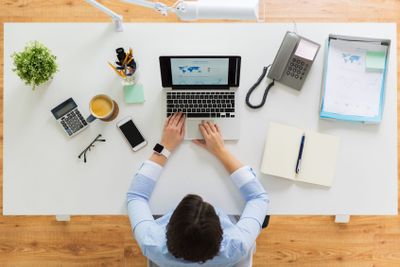 businesswoman working on laptop at office