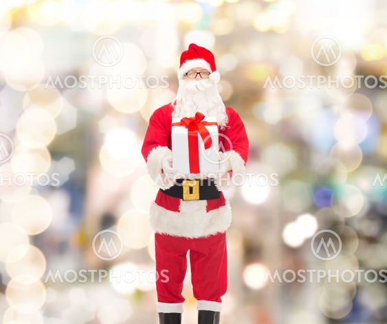 man in costume of santa claus with gift box