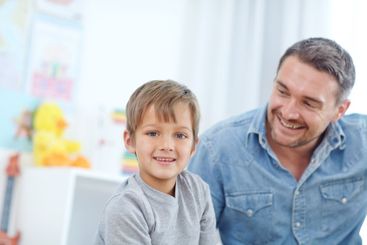 Father, smile and child relax in home for care, bonding...