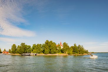 Boats and forest on lake in Helsinki, Finland