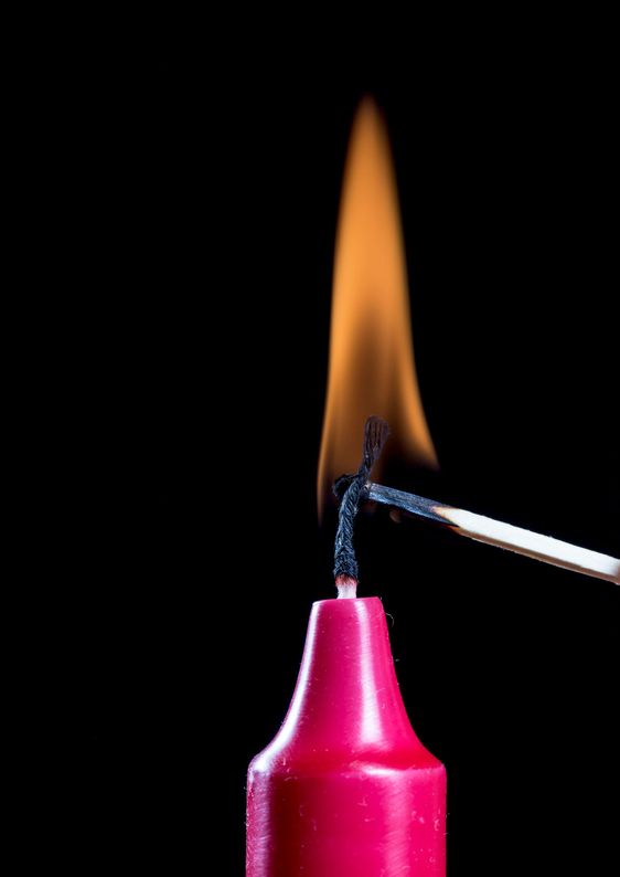 Red Candle Stick Burning