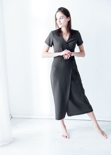 beautiful fashionable slender woman in a gray summer...