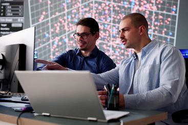 Man in cyber data team monitoring computer technology in...
