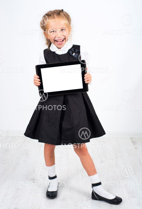 cute schoolgirl with a pc tablet