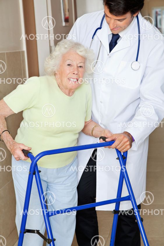 Senior Woman Being Assisted By Doctor