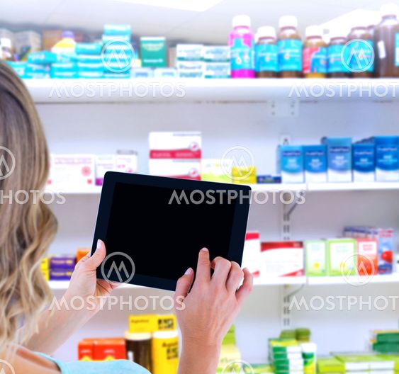 Composite image of rear view of woman using tablet pc