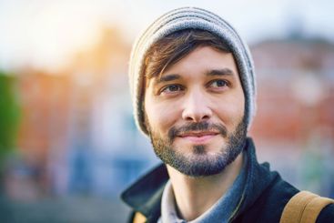 Man, thinking and happy in city for tourism, sightseeing...