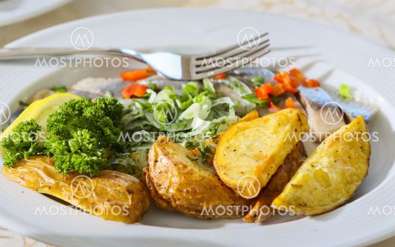 Pieces of potato and fish