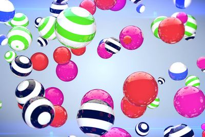 Abstract multicoloured spheres of different size flying...