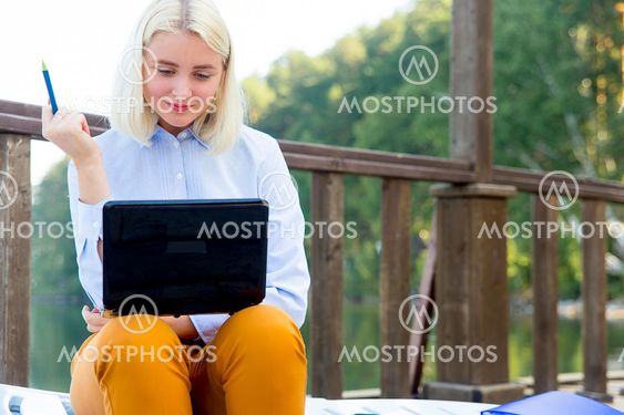 Businesswoman working on a beach