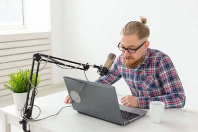 Radio, DJ, blogging and people concept - Smiling man...