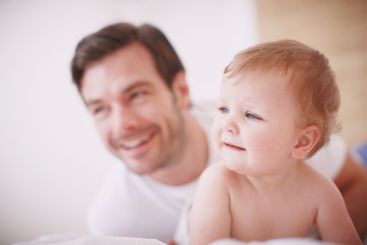 Baby, father and relax together in home, love and...