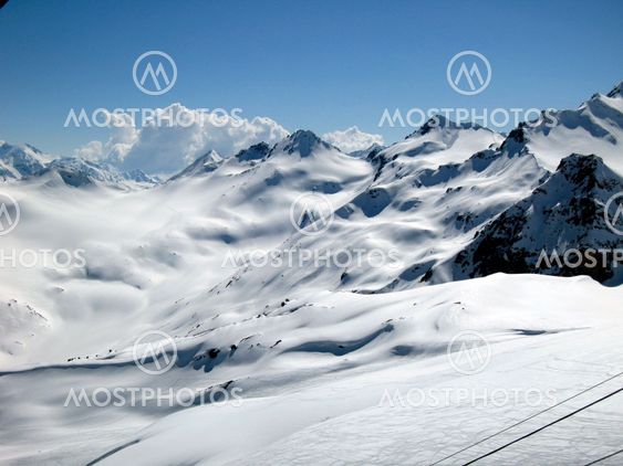 Mountain under the blue sky and the clouds