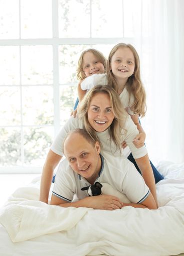 Joyful family relaxing on the couch together at home
