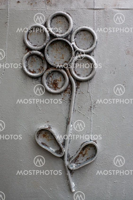 Metal flower on a plain background