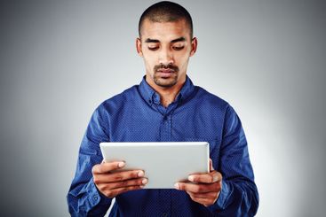 Studio, businessman and professional with tablet for...