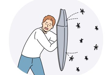 Man defends himself from mosquitoes using shield and...