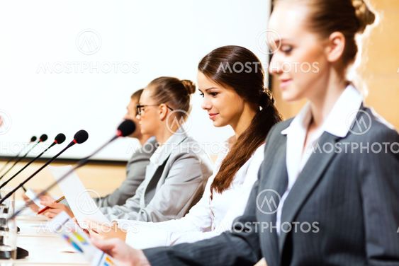 businessmen communicate at the conference