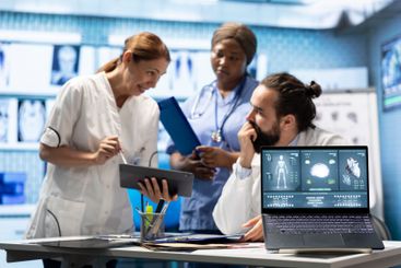 Doctors cardiologist analyze human anatomy scans to...