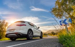 rental car in spain mountain landscape road at sunset