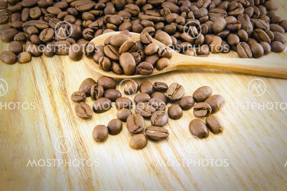 Coffee beans on vintage wooden board