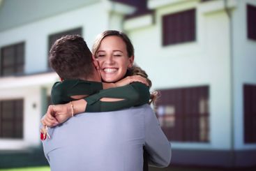 Happy Couple Holding Home Keys