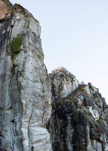 Large rocky rocks. Rocks of rocks. Gray moss-covered rocks