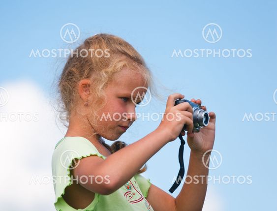 Little girl with photo camera