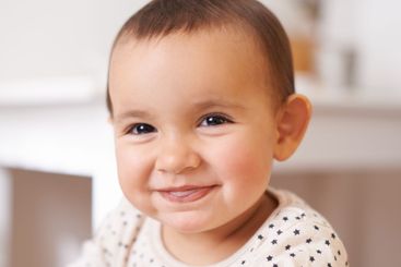 Baby, toddler portrait and smile in home, childhood and...