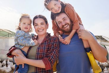 Farm, chicken and portrait of parents with kids in field...