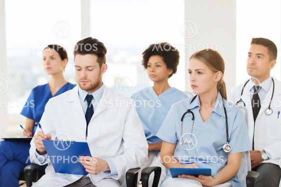 group of happy doctors on seminar at hospital