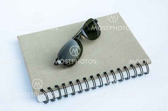 Sunglasses on a spiral notebook