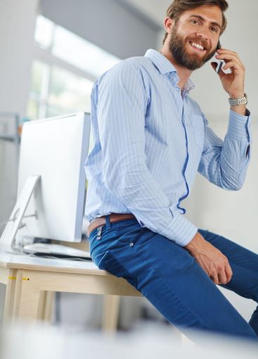 Man, architect and phone call in office, working and...