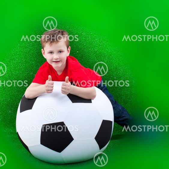 Happy young boy with soccer ball