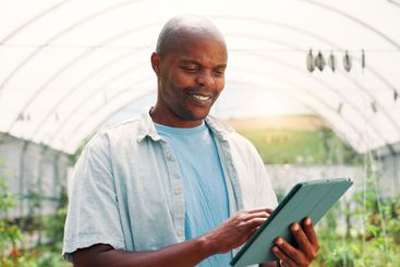 Farming, black man and smile with tablet for...