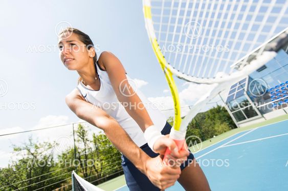 Young woman playing tennis